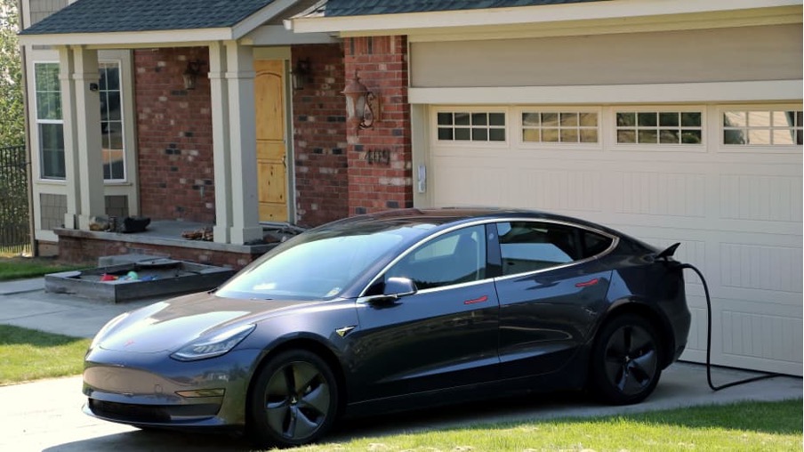 tesla in a driveway